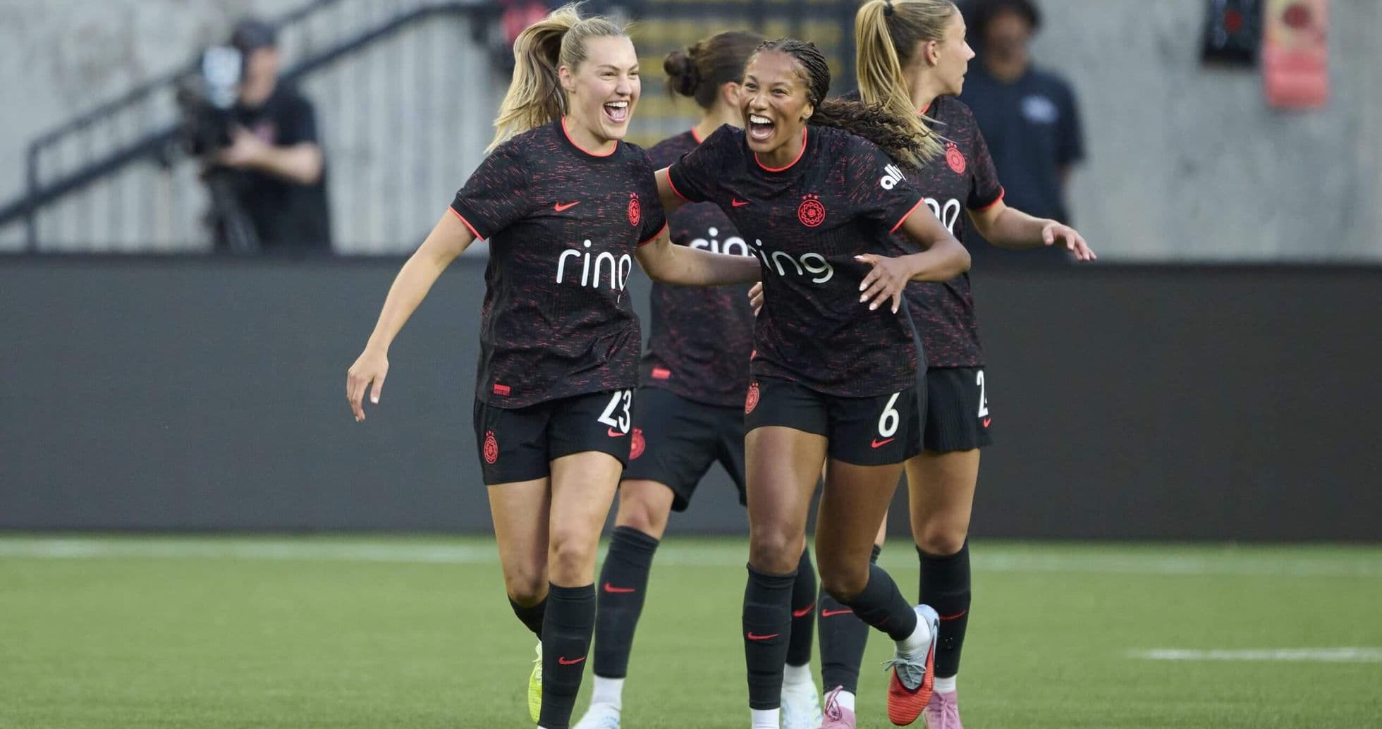Portland Thorns players celebrating a goal Portland Thorns players celebrating a goal