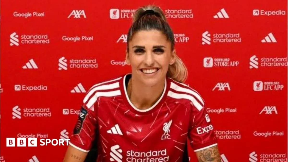 Player in Liverpool kit at press conference Player in Liverpool kit at press conference