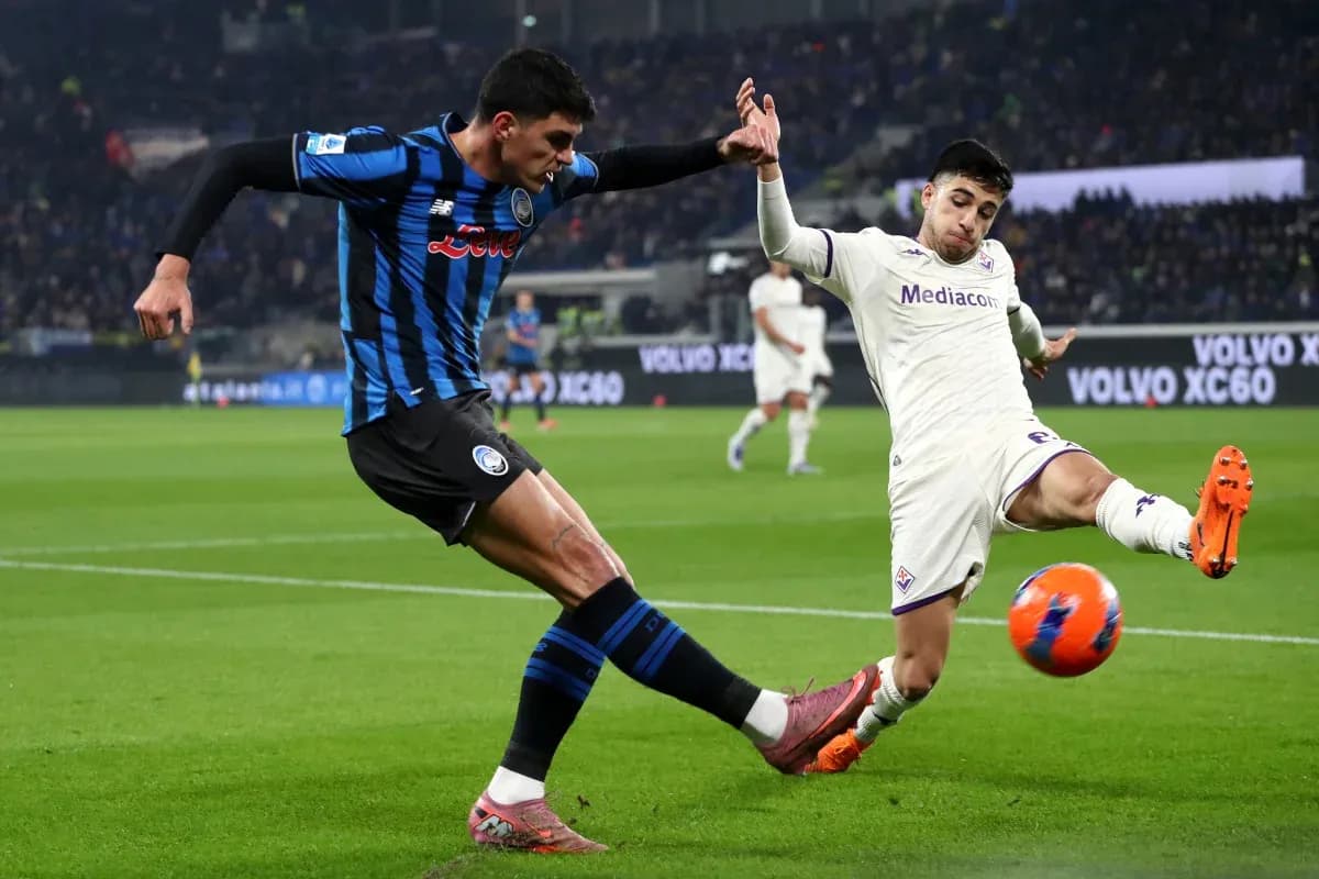 Fiorentina player challenging Atalanta opponent for ball Fiorentina player challenging Atalanta opponent for ball