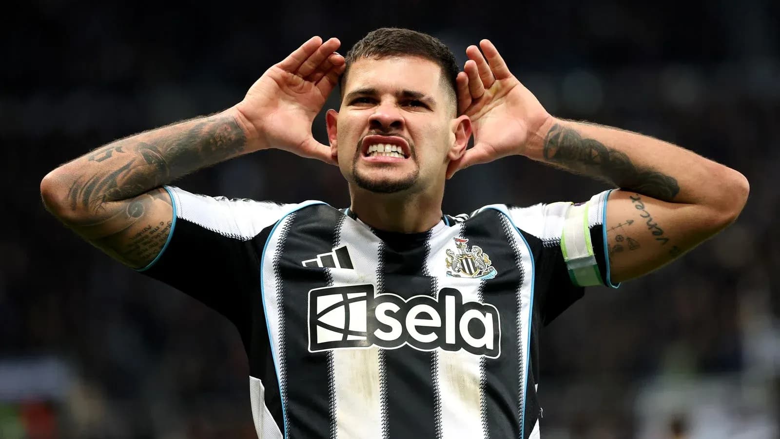 Player celebrating with hands on ears after goal Player celebrating with hands on ears after goal