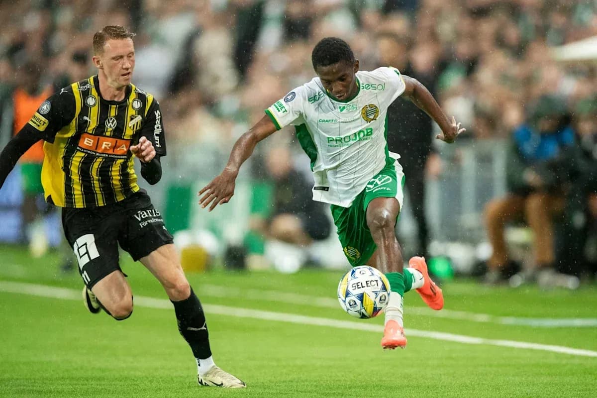 Player dribbling the ball past opponent during match Player dribbling the ball past opponent during match