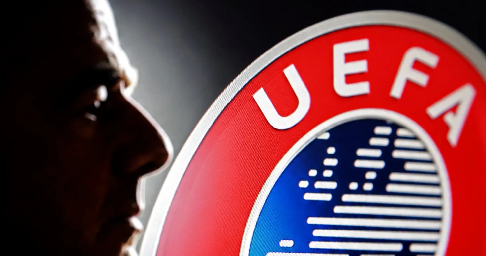 Profile silhouette next to UEFA logo Profile silhouette next to UEFA logo