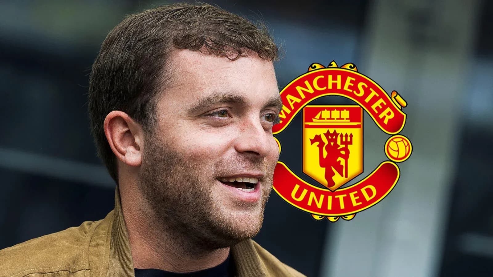 Person smiling with Manchester United logo in background Person smiling with Manchester United logo in background
