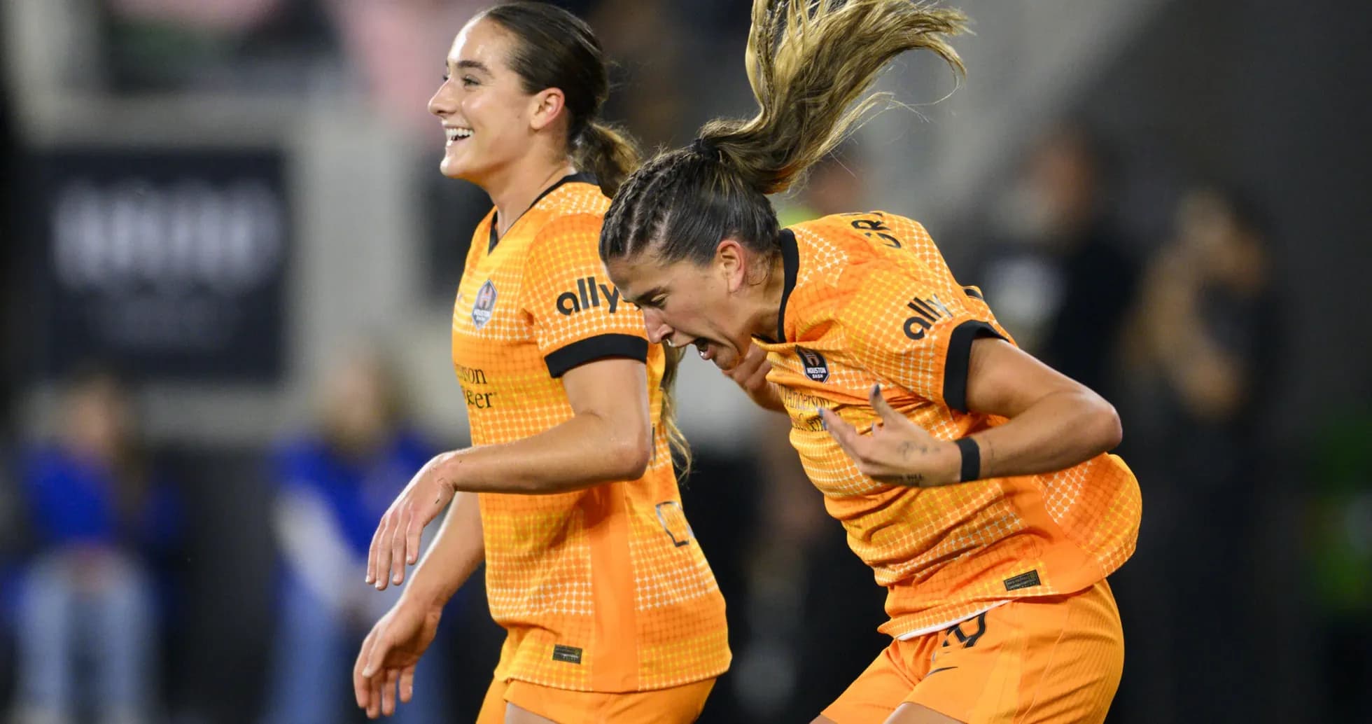 Houston Dash players celebrating a goal Houston Dash players celebrating a goal