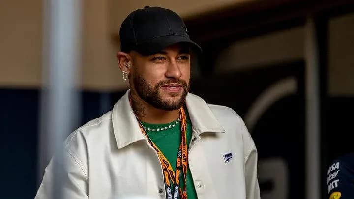 Man wearing a cap and jacket smiling outdoors Man wearing a cap and jacket smiling outdoors