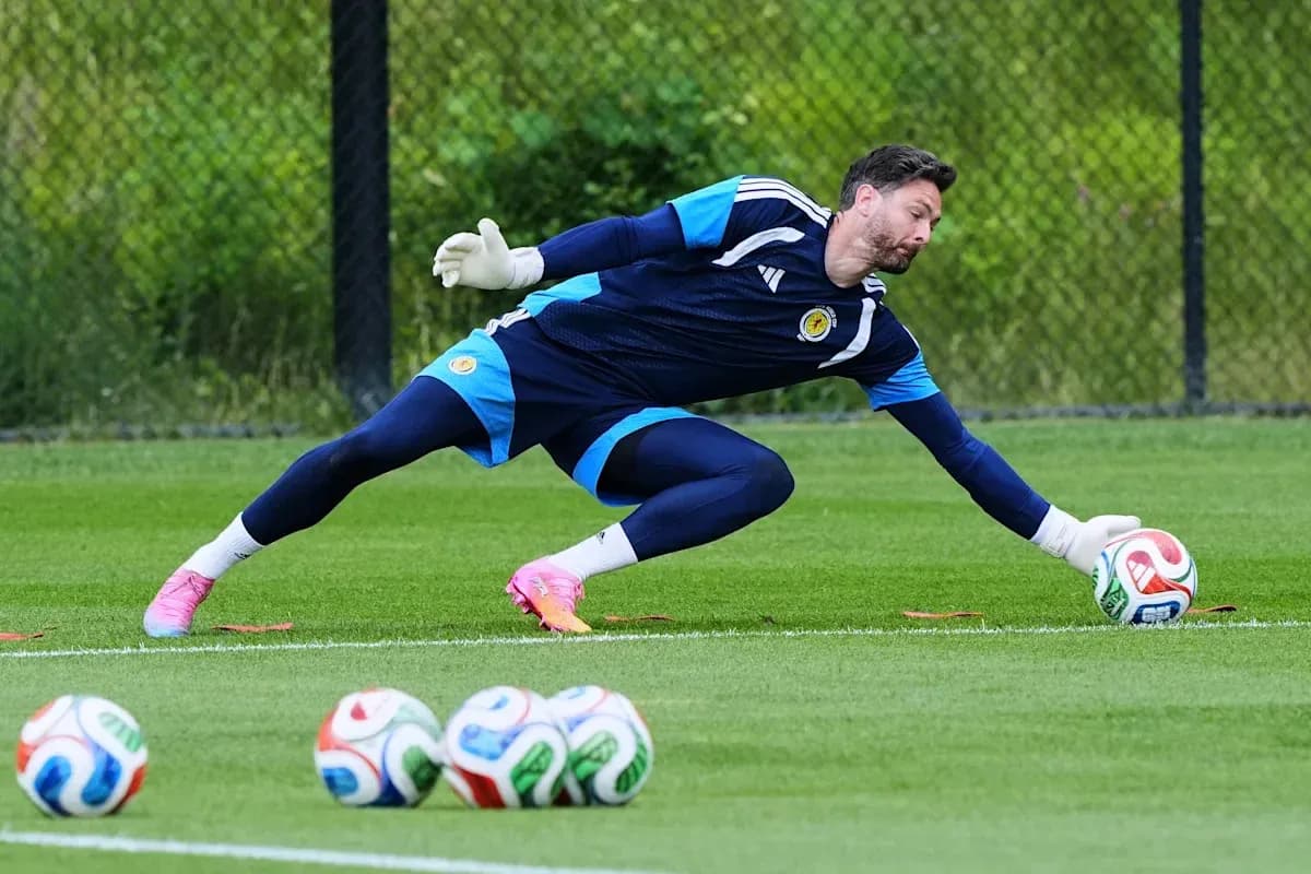 Goalkeeper diving to catch a soccer ball during practice Goalkeeper diving to catch a soccer ball during practice