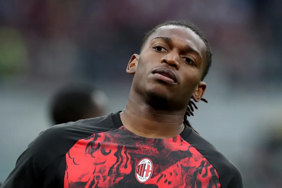 Player warming up in AC Milan training kit Player warming up in AC Milan training kit