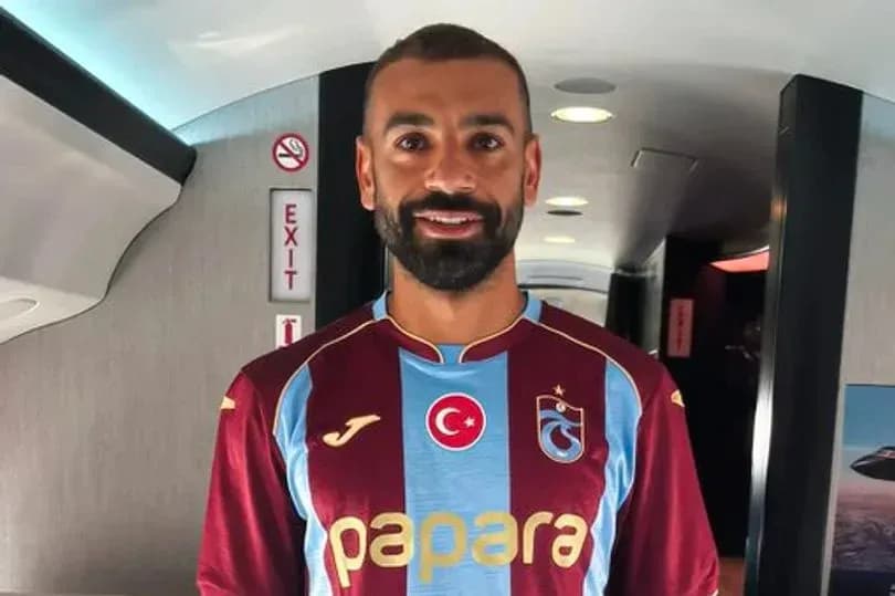 Player wearing Trabzonspor jersey inside aircraft Player wearing Trabzonspor jersey inside aircraft