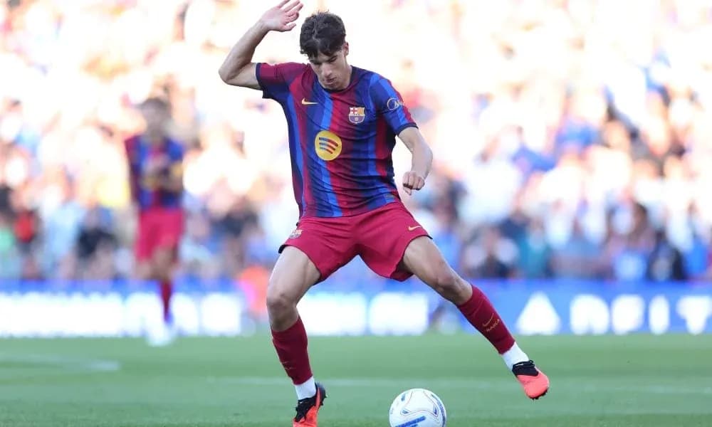 Player in Barcelona kit controlling the ball on field Player in Barcelona kit controlling the ball on field