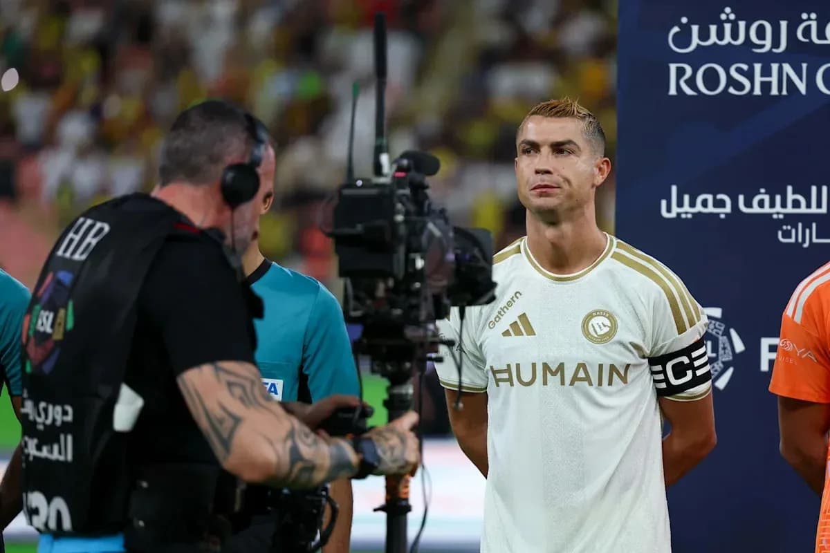 Player standing with camera crew before match Player standing with camera crew before match