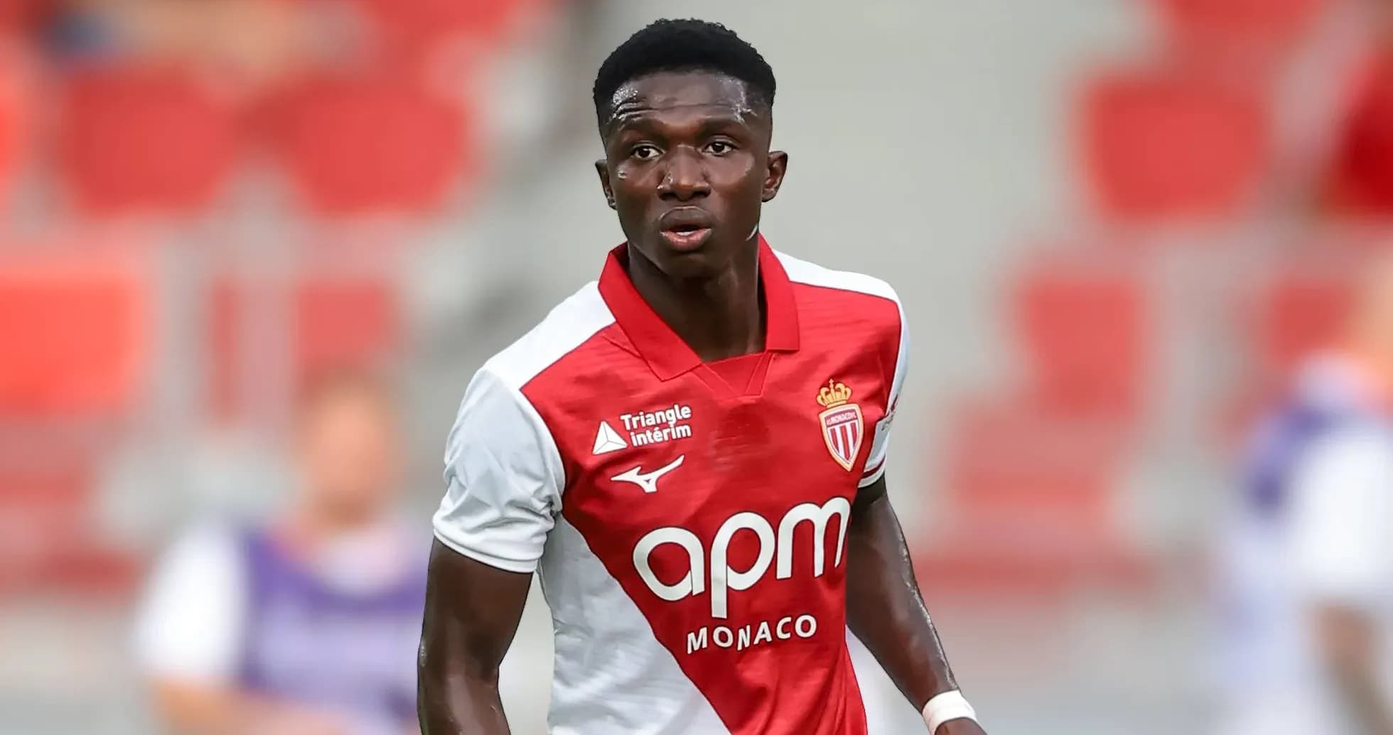 Monaco player in red and white jersey during match Monaco player in red and white jersey during match