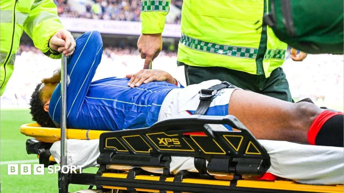 Player being treated and transported on stretcher Player being treated and transported on stretcher