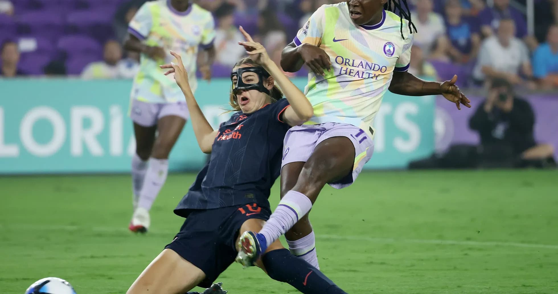 Bay FC W player tackling Orlando Pride W opponent Bay FC W player tackling Orlando Pride W opponent