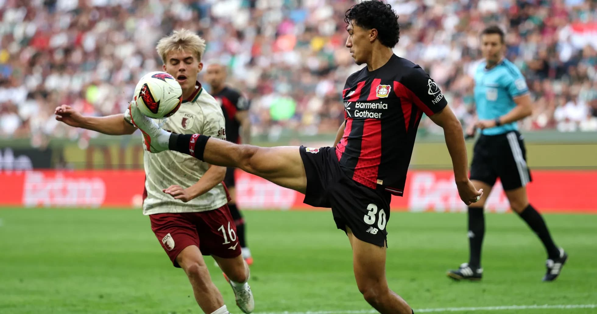 Player kicking the ball during a match action Player kicking the ball during a match action