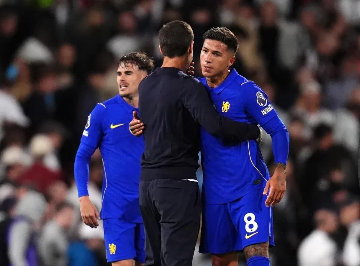 Chelsea players embracing coach after match Chelsea players embracing coach after match