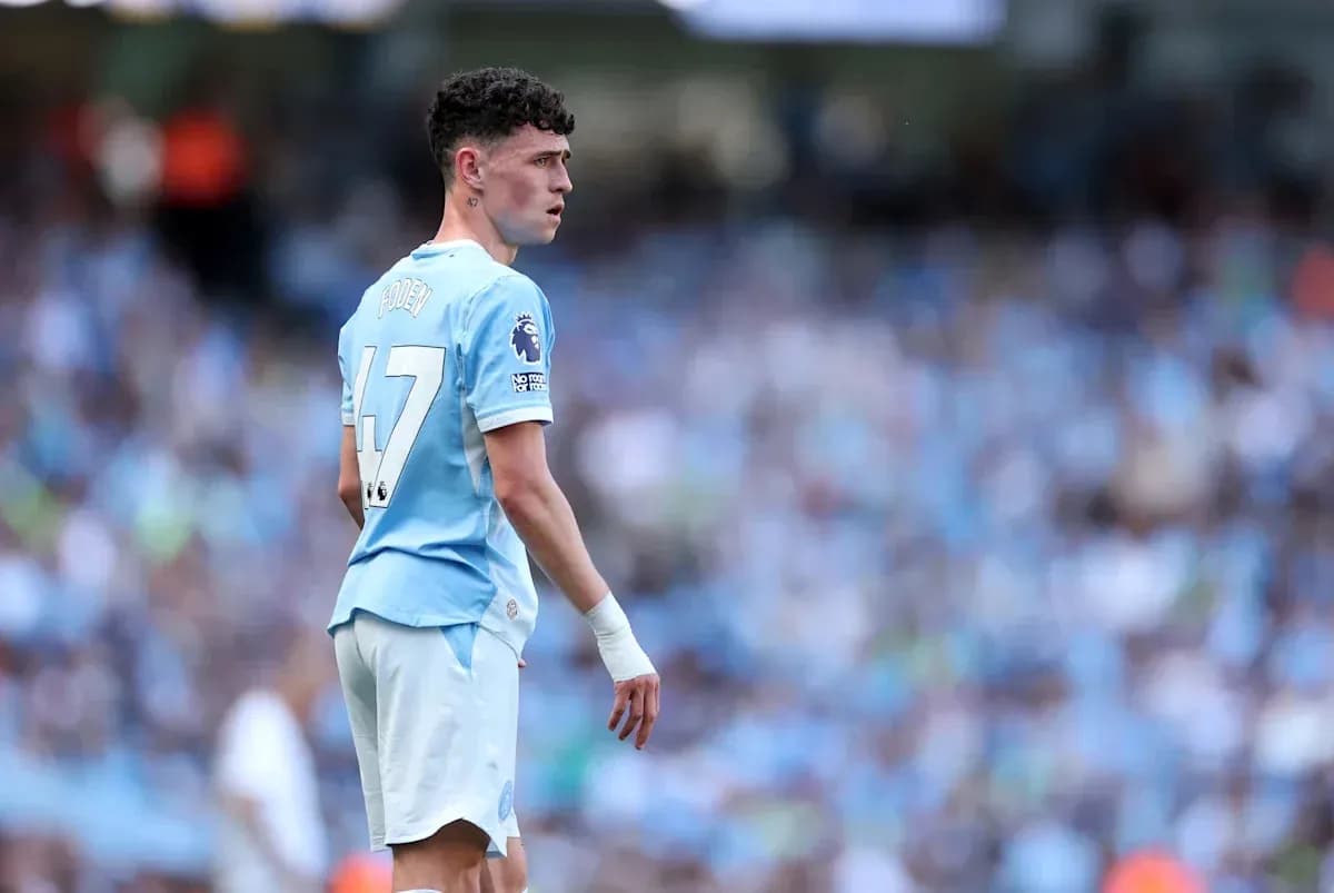Phil Foden in Manchester City kit during match Phil Foden in Manchester City kit during match