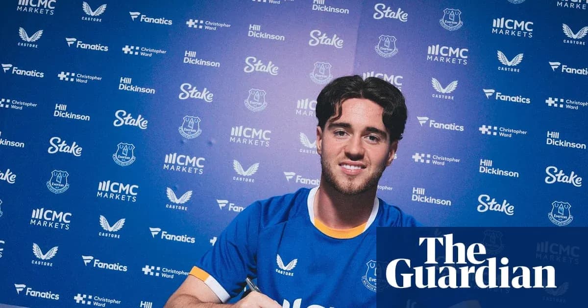 Player signing contract at Everton press conference Player signing contract at Everton press conference