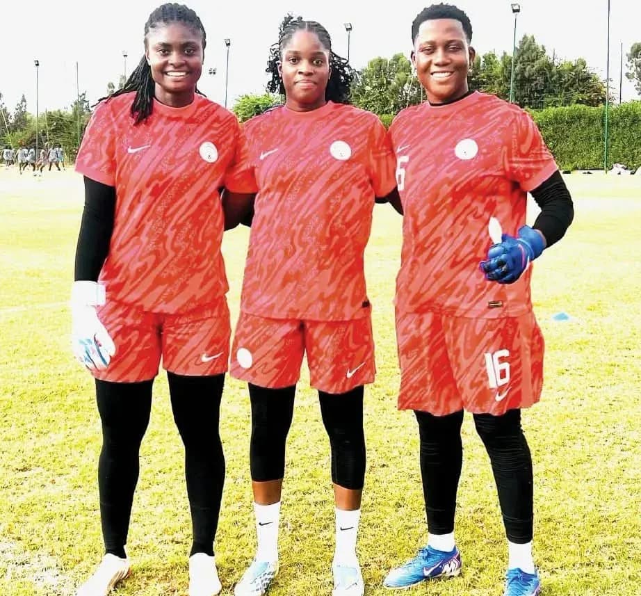 Three soccer players posing in training kits Three soccer players posing in training kits