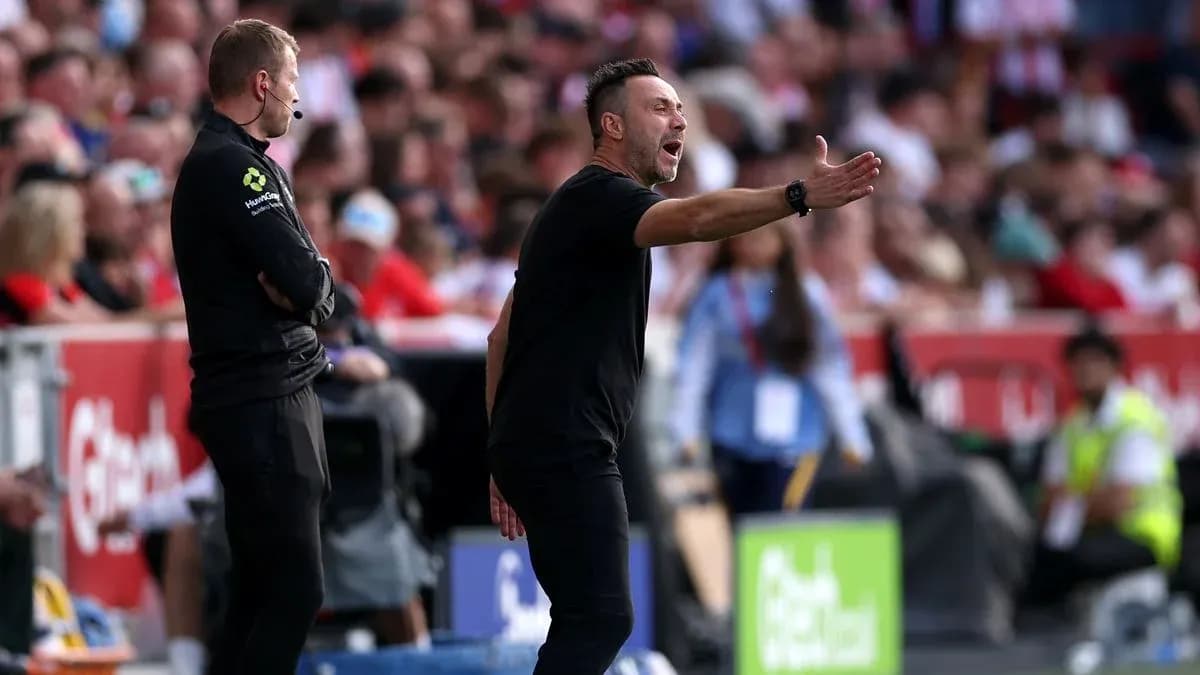 Coach gesturing during a football match on sidelines Coach gesturing during a football match on sidelines