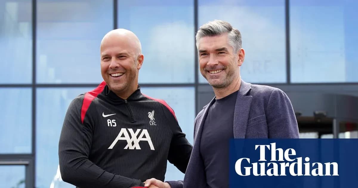Two men shaking hands outside a Liverpool facility Two men shaking hands outside a Liverpool facility