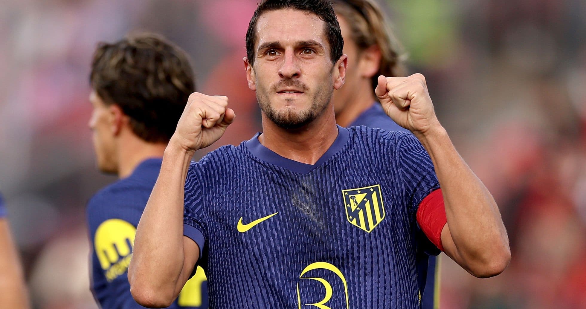 Atletico Madrid player celebrating a victory Atletico Madrid player celebrating a victory