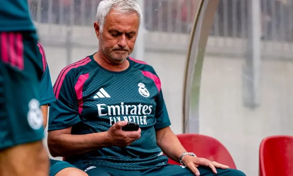 Manager sitting on bench using mobile phone Manager sitting on bench using mobile phone