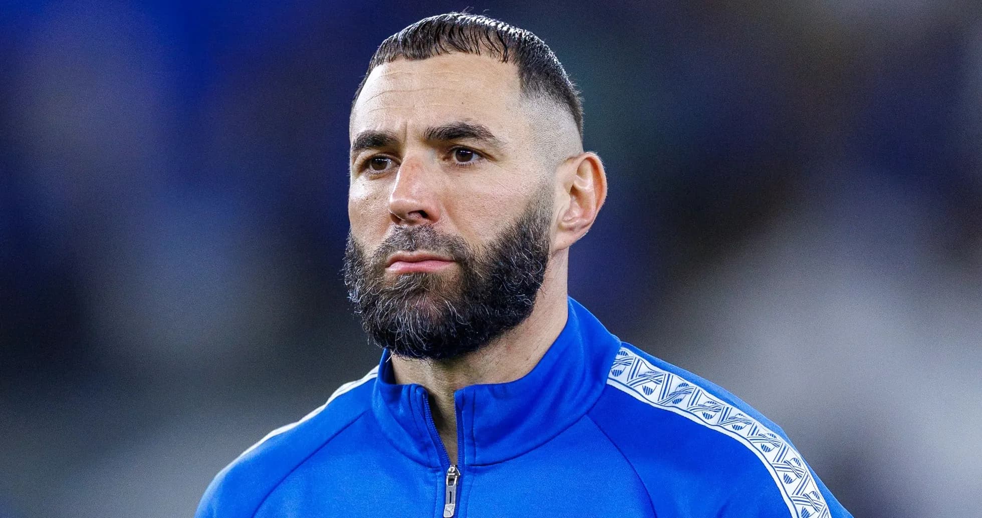Player in blue training kit with beard Player in blue training kit with beard