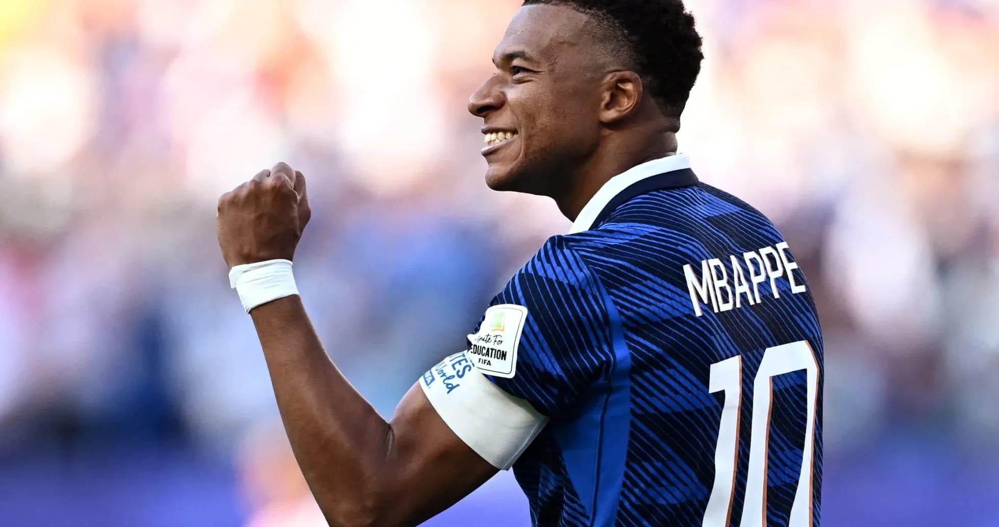 Player celebrating with fist raised during match Player celebrating with fist raised during match