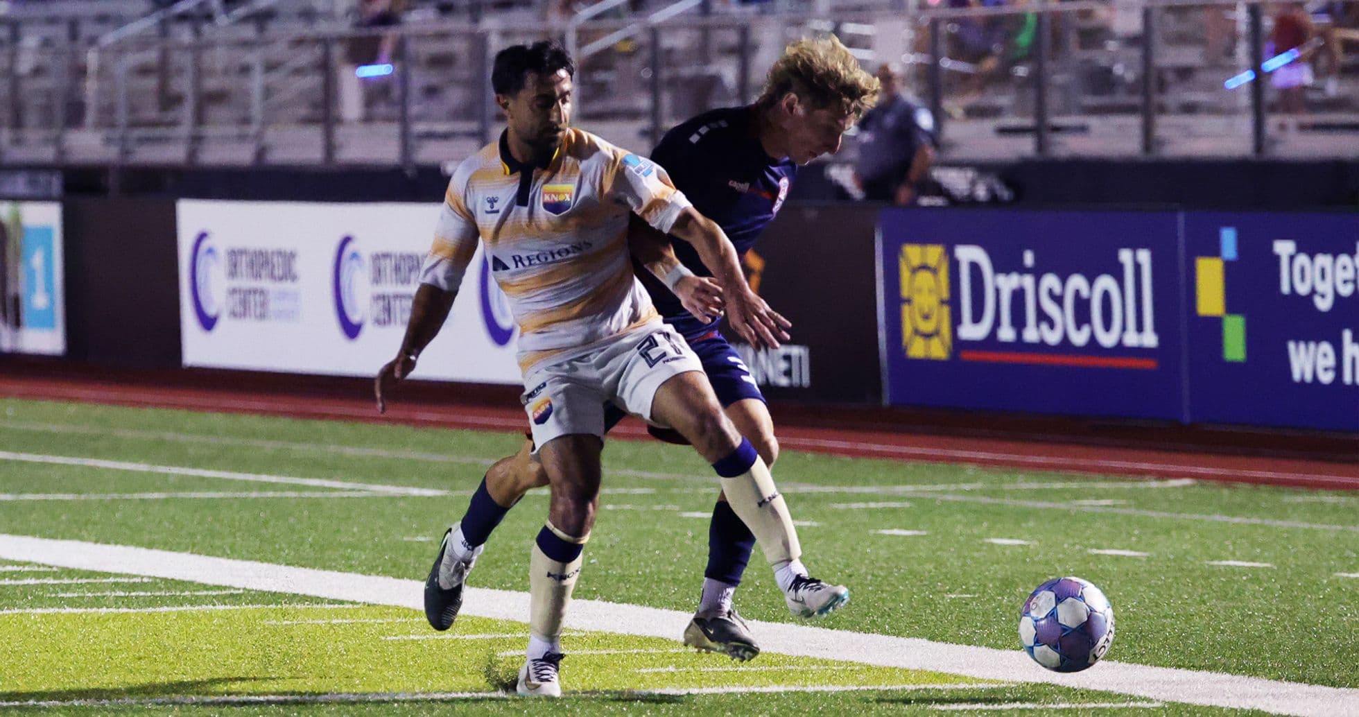 One Knoxville player dribbling the ball against Chattanooga One Knoxville player dribbling the ball against Chattanooga