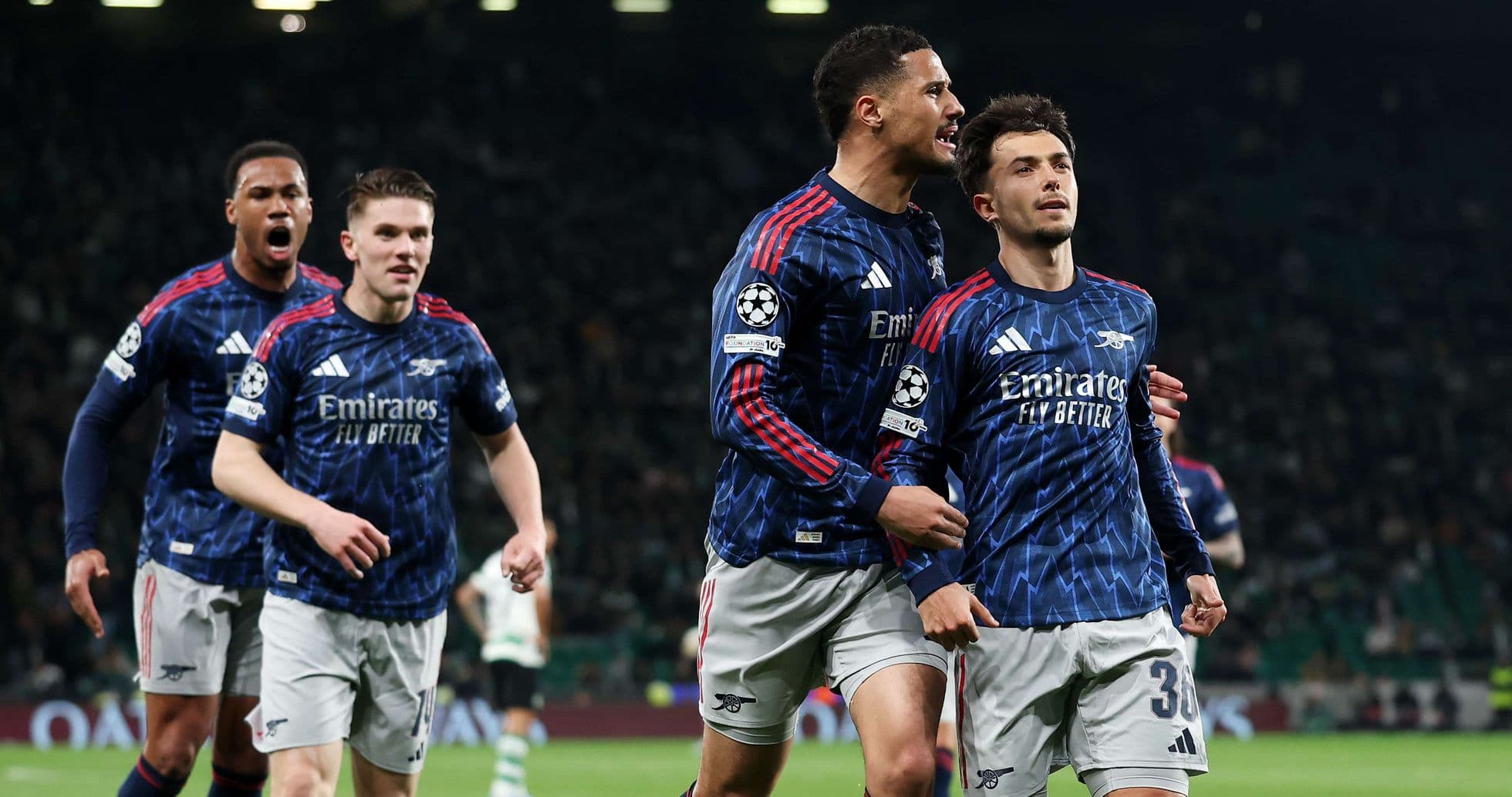 Arsenal players celebrating a goal in UEFA match Arsenal players celebrating a goal in UEFA match