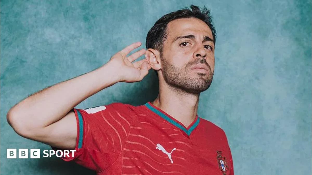 Football player posing in red Portugal jersey Football player posing in red Portugal jersey