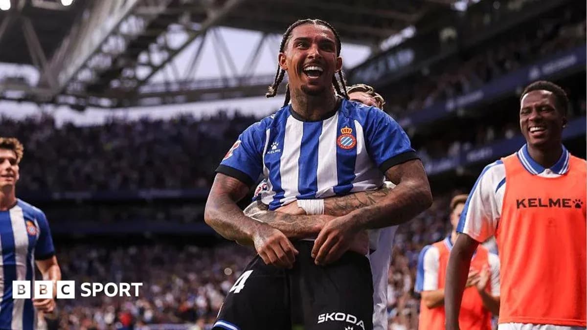 Player celebrating with teammates after scoring a goal Player celebrating with teammates after scoring a goal