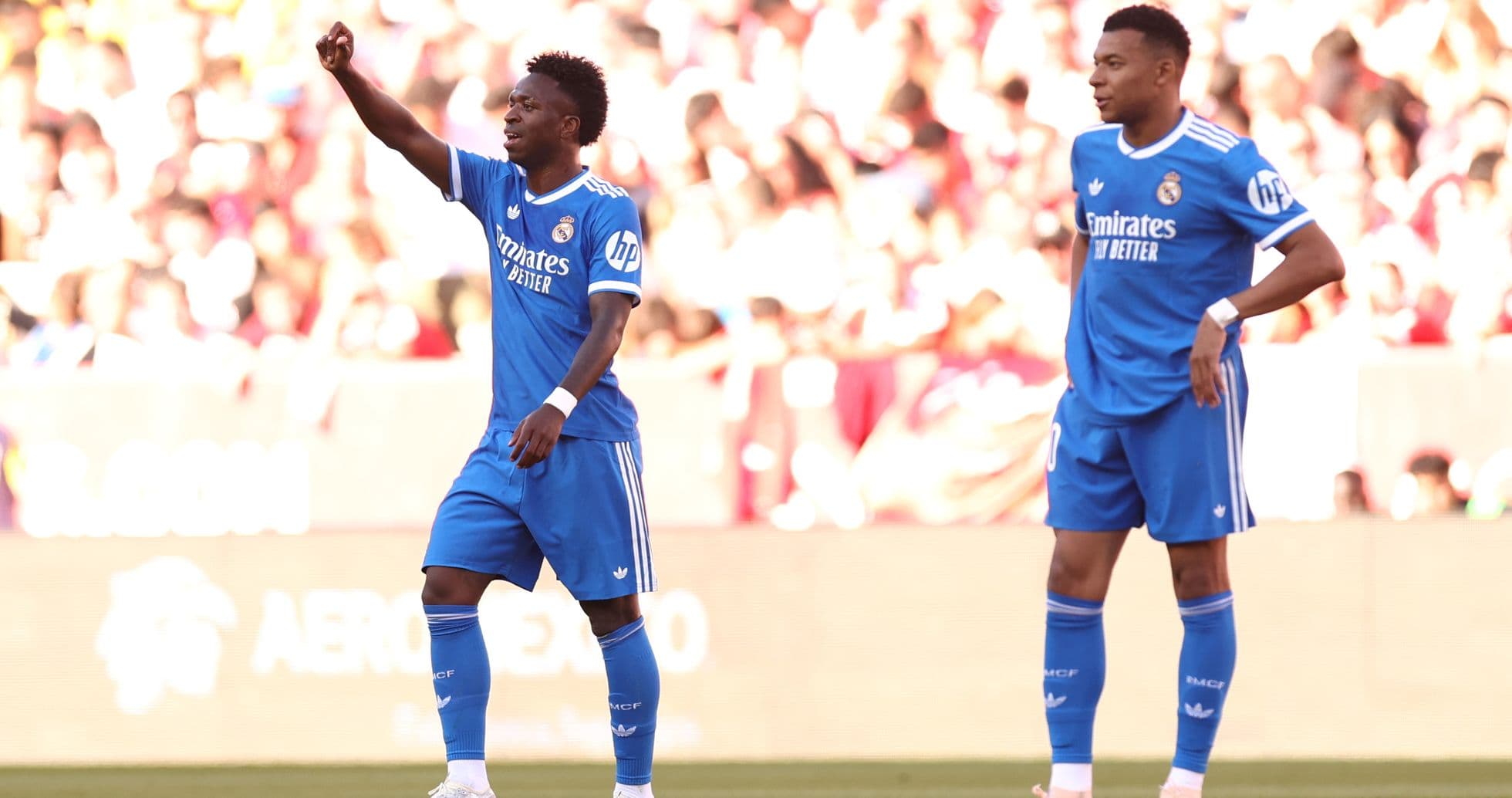 Vinícius Júnior celebrating with teammates during match Vinícius Júnior celebrating with teammates during match