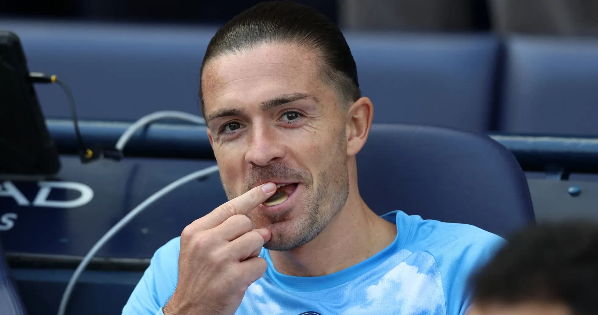 Player sitting on bench eating during match Player sitting on bench eating during match