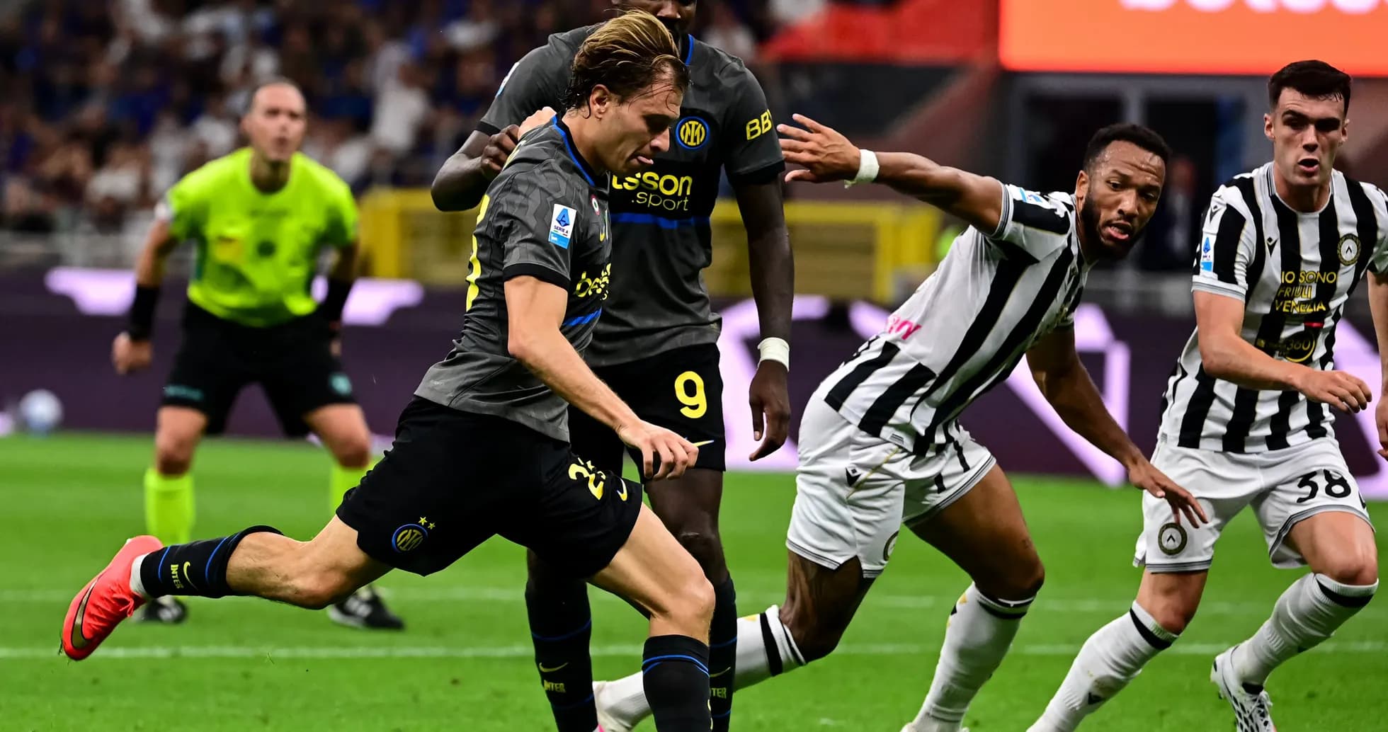 Inter Milan player sprinting past Udinese defenders Inter Milan player sprinting past Udinese defenders
