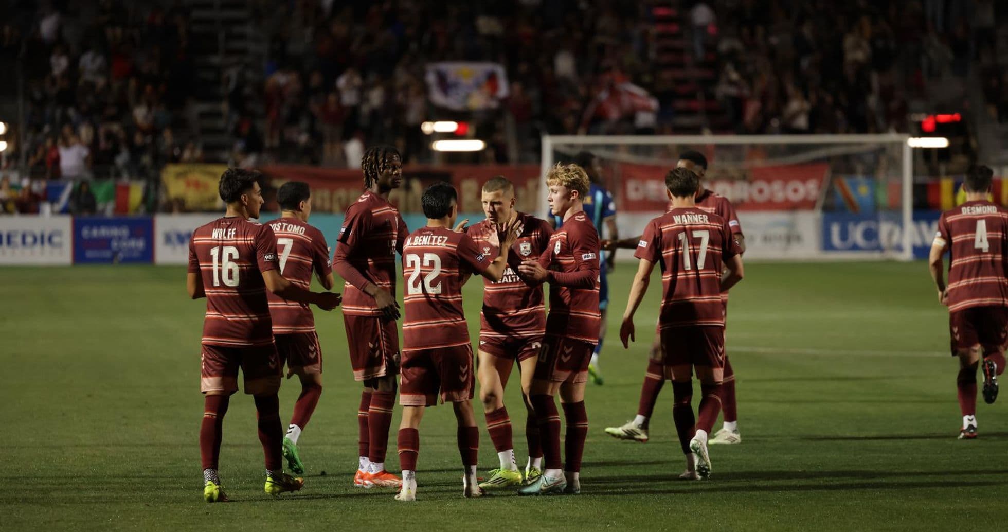 Players celebrating a goal during USL Championship match Players celebrating a goal during USL Championship match