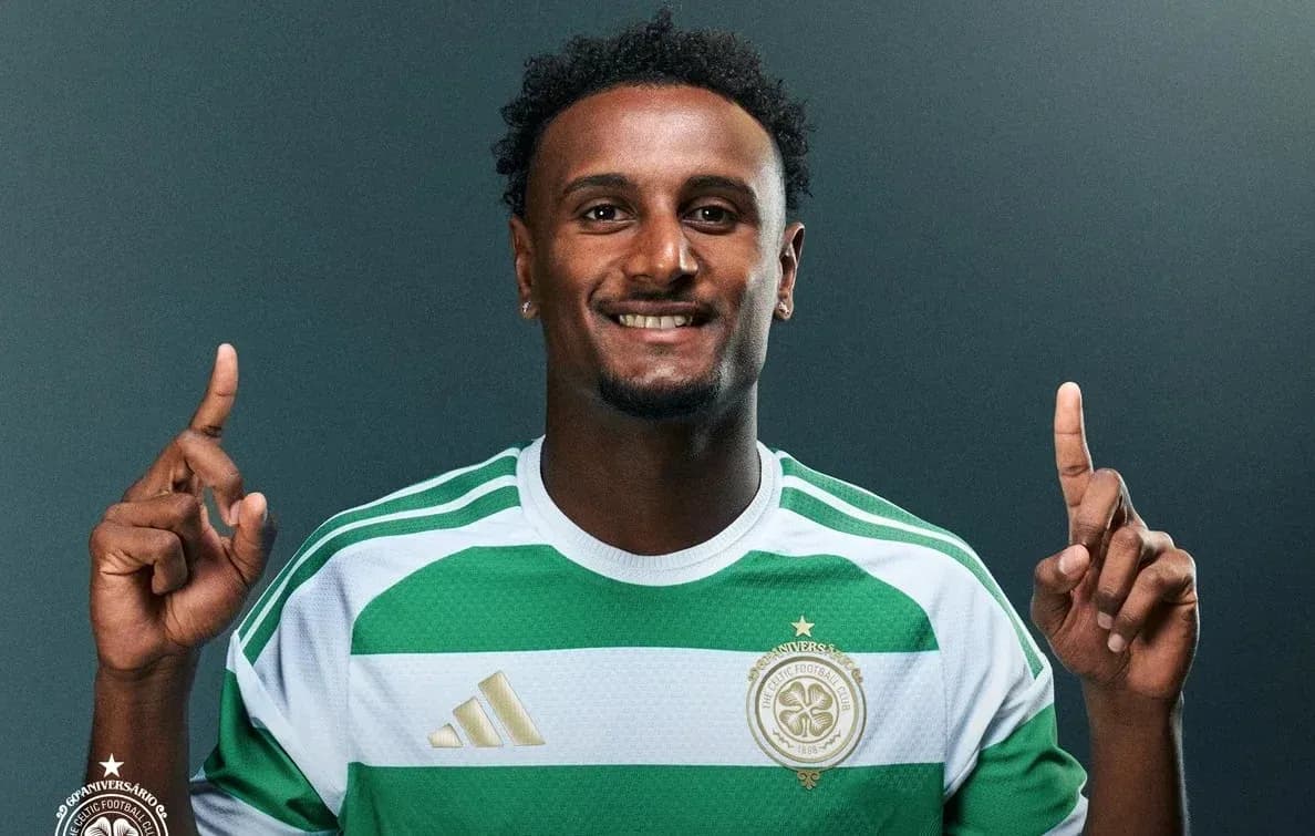 Player posing in Celtic FC jersey with raised fingers Player posing in Celtic FC jersey with raised fingers