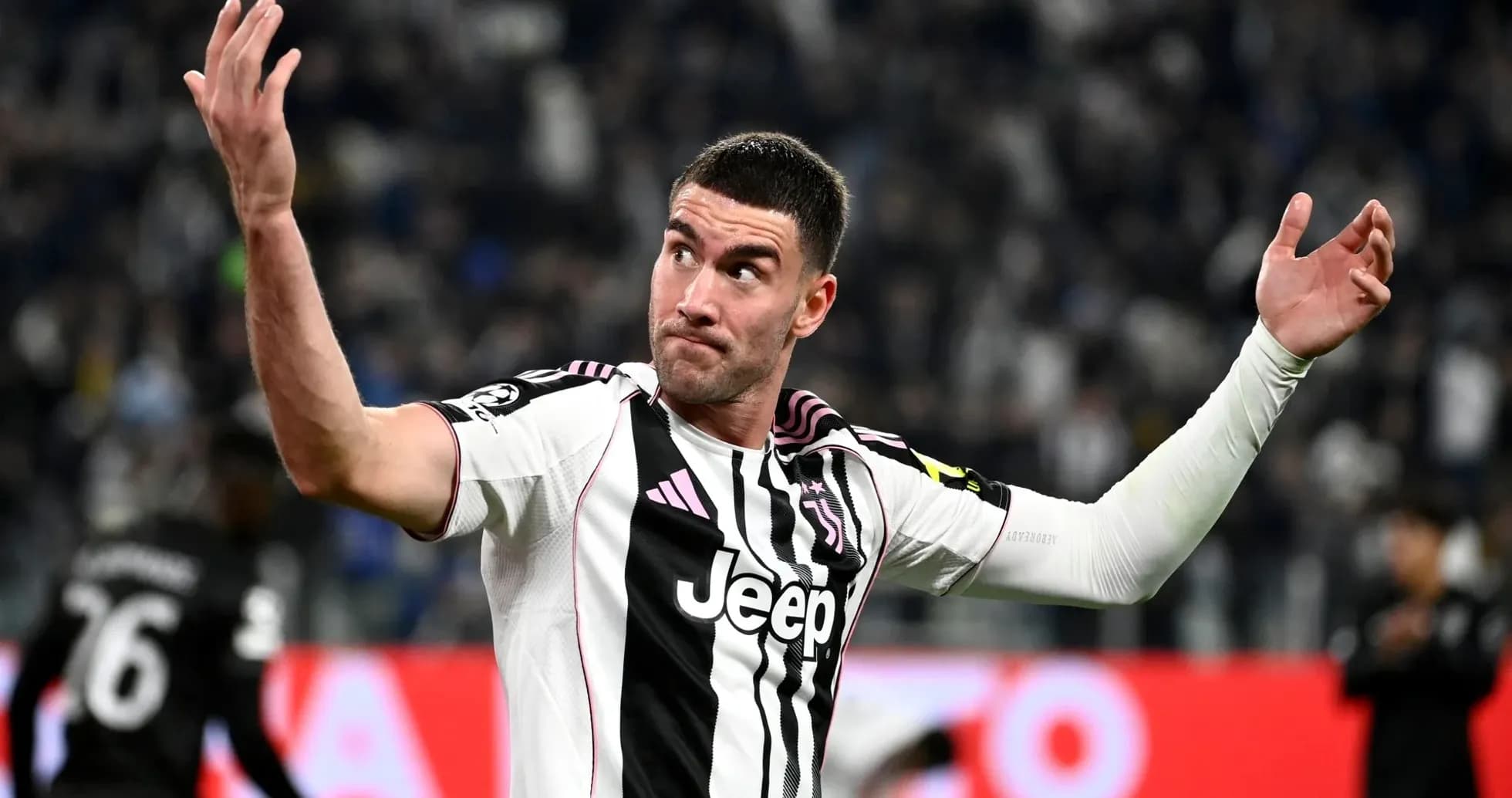 Juventus player gesturing during a match Juventus player gesturing during a match