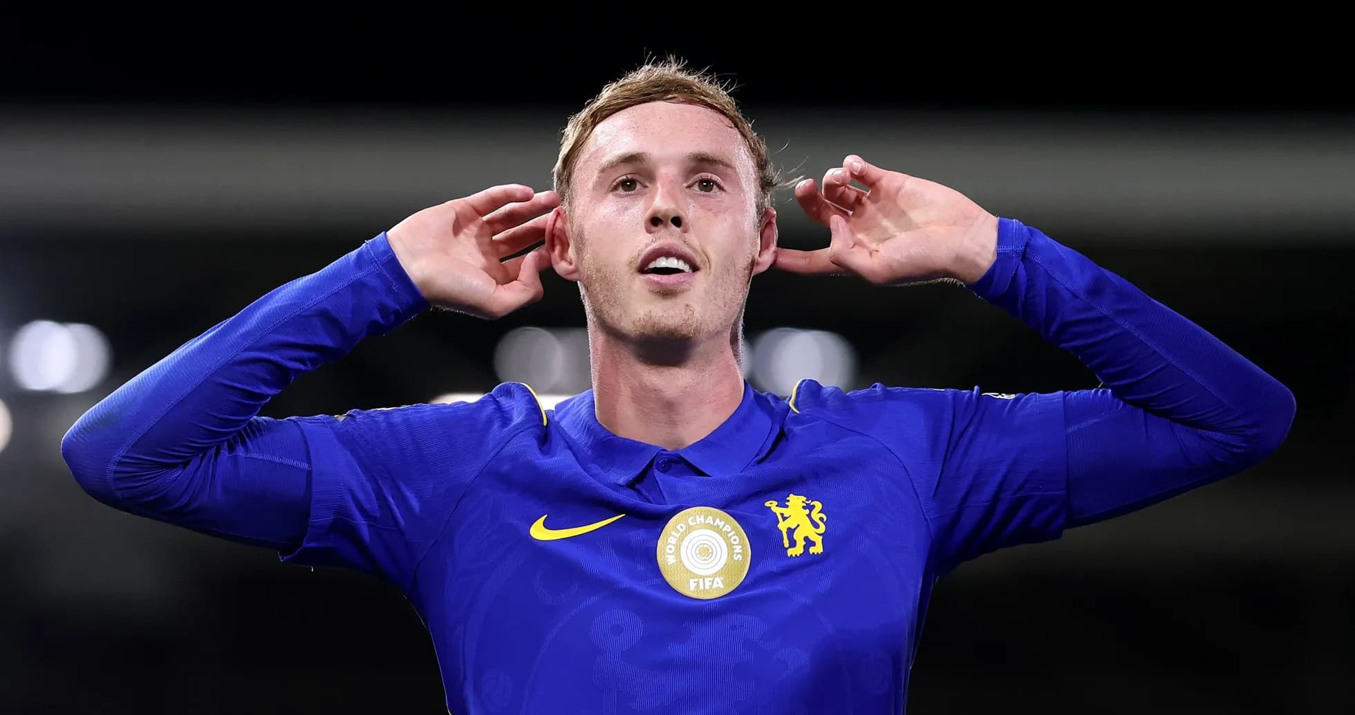 Player celebrating with hands on ears after scoring Player celebrating with hands on ears after scoring