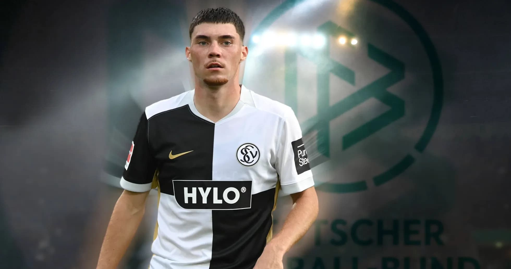 Player in black and white jersey on field Player in black and white jersey on field
