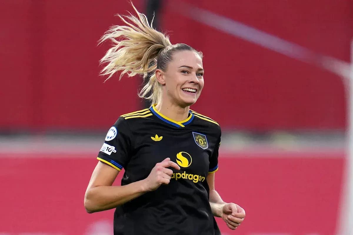 Female player celebrating during a football match Female player celebrating during a football match