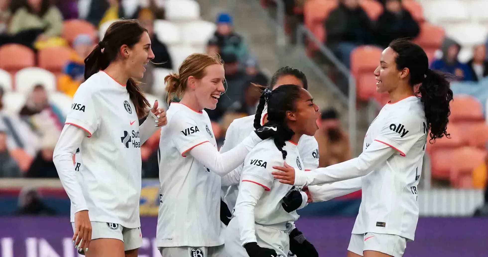 Players celebrating a goal during NWSL match Players celebrating a goal during NWSL match