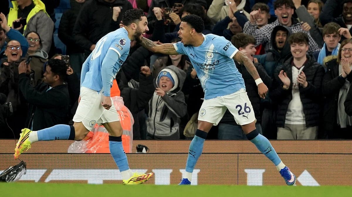 Manchester City players celebrating a goal Manchester City players celebrating a goal