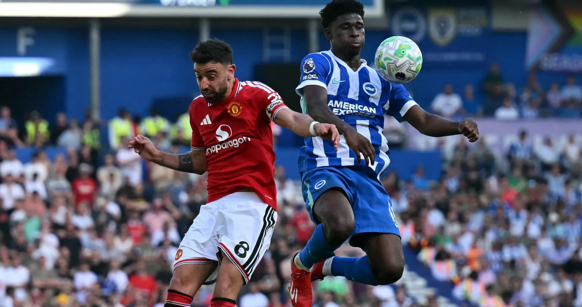 Bruno Fernandes and defender contesting a high ball Bruno Fernandes and defender contesting a high ball