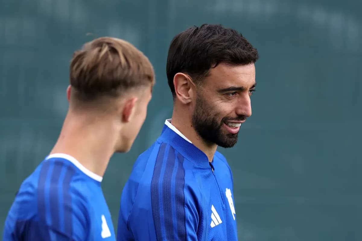 Two players chatting during training session Two players chatting during training session