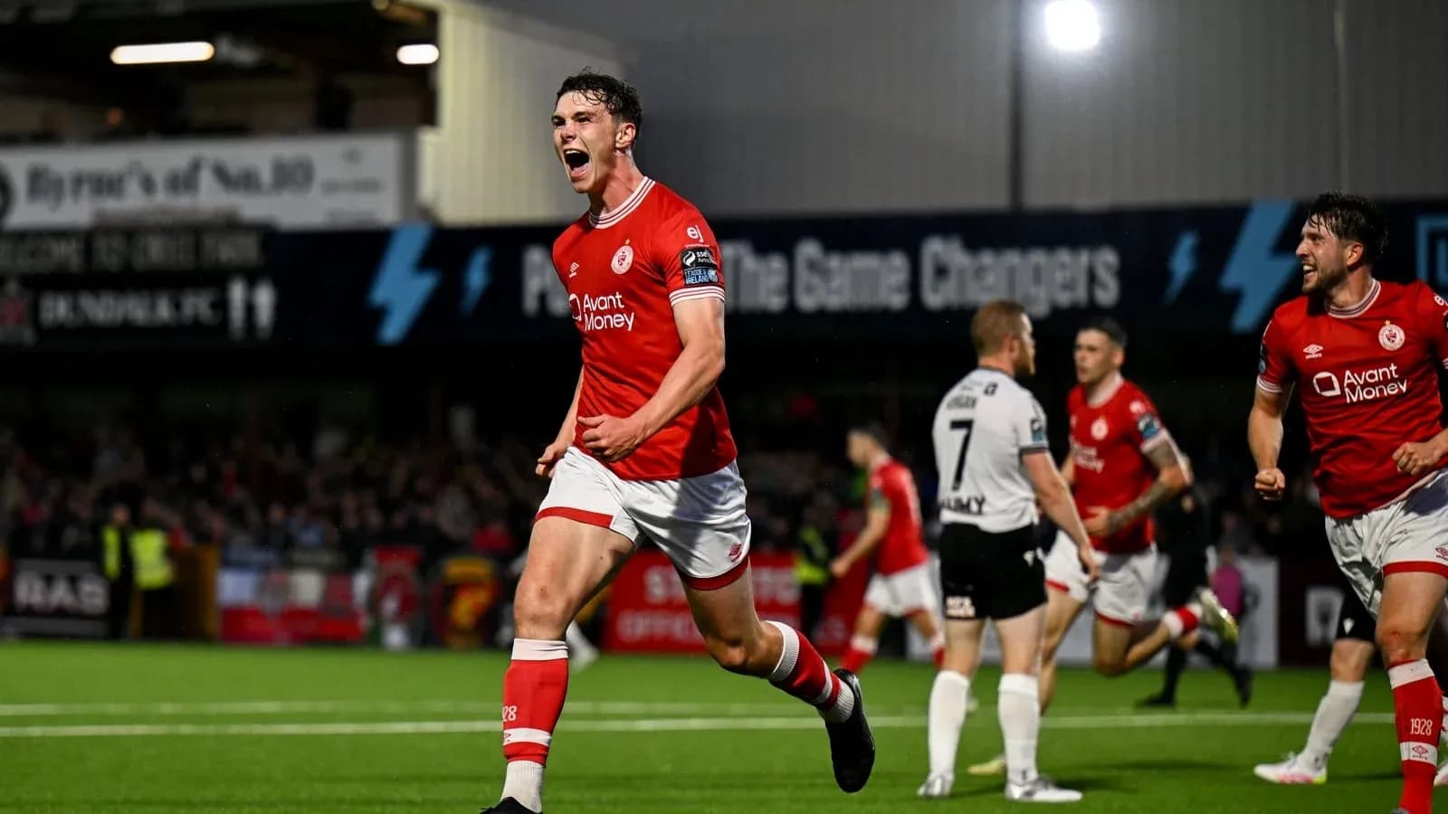 Player celebrating a goal during a football match Player celebrating a goal during a football match