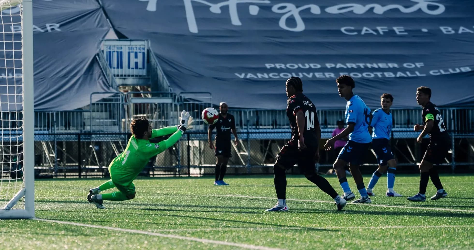 Goalkeeper saving a shot during match Goalkeeper saving a shot during match