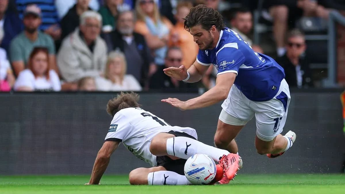 Player tackling opponent on the ground during match Player tackling opponent on the ground during match