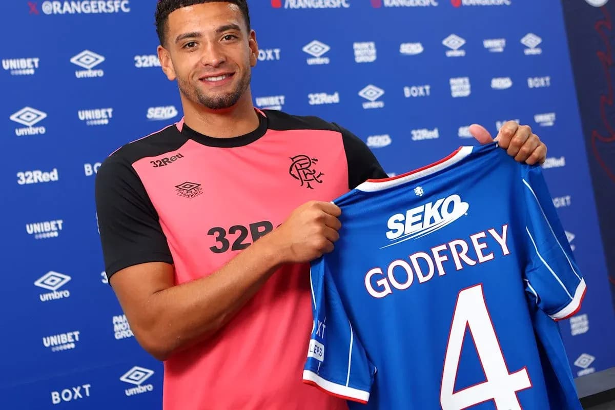 Player holding Rangers FC jersey with Godfrey name Player holding Rangers FC jersey with Godfrey name