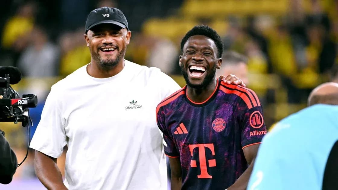 Two men laughing on the football field Two men laughing on the football field